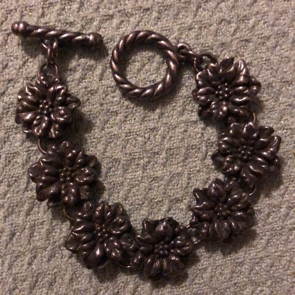 sterling bracelet of flowers..linked toggled clasp